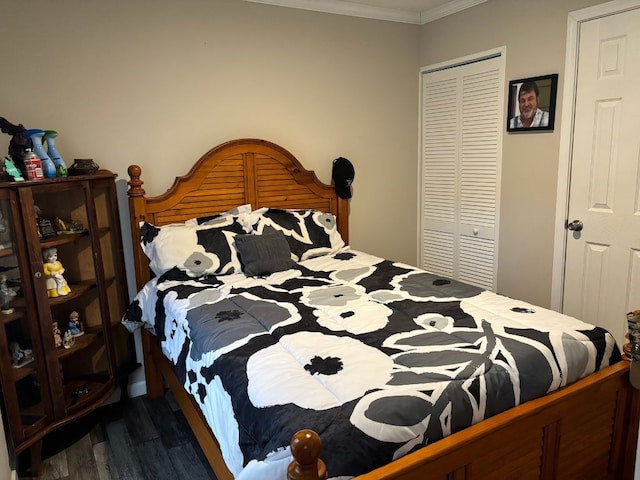 bedroom with dark hardwood / wood-style floors, a closet, and ornamental molding