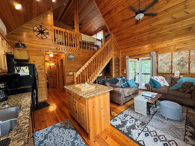 275 Walkers Rdg, Murphy, NC 28906 - living room featuring high vaulted ceiling, stairway, wooden walls, wood ceiling, and light wood-style floors