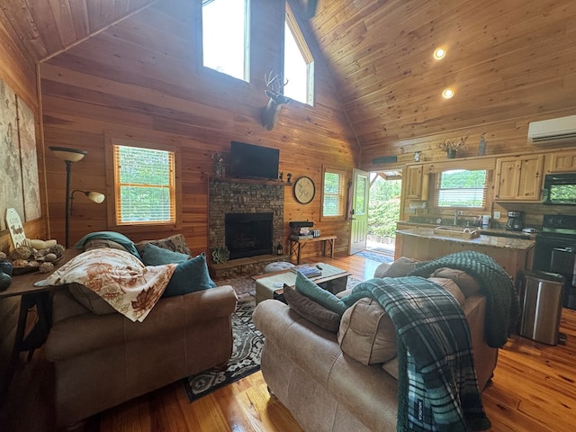 275 Walkers Rdg, Murphy, NC 28906 - living room with wooden walls, a wall mounted AC, healthy amount of natural light, wood ceiling, and light wood-style floors