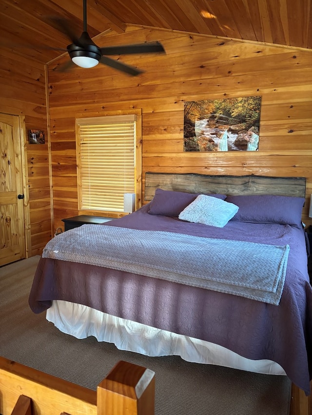 carpeted bedroom featuring wooden walls, lofted ceiling with beams, and wood ceiling