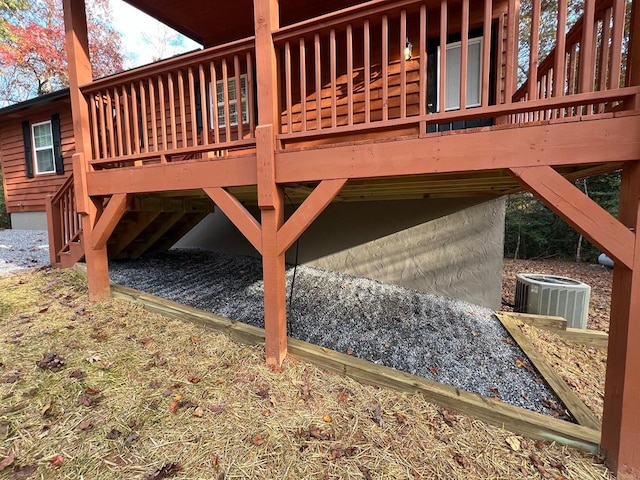 view of home's exterior with central AC and a deck
