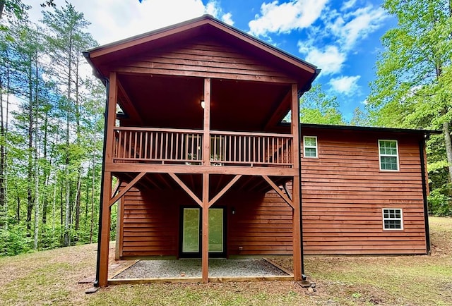 back of property with a patio area and a balcony