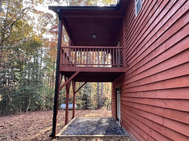 view of side of home with a deck
