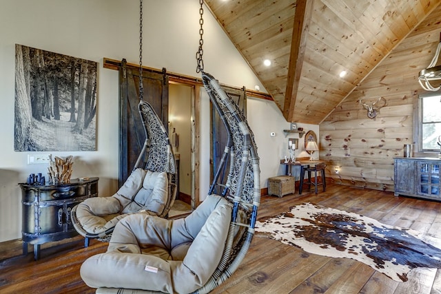 living area with hardwood / wood-style flooring, wood ceiling, and high vaulted ceiling