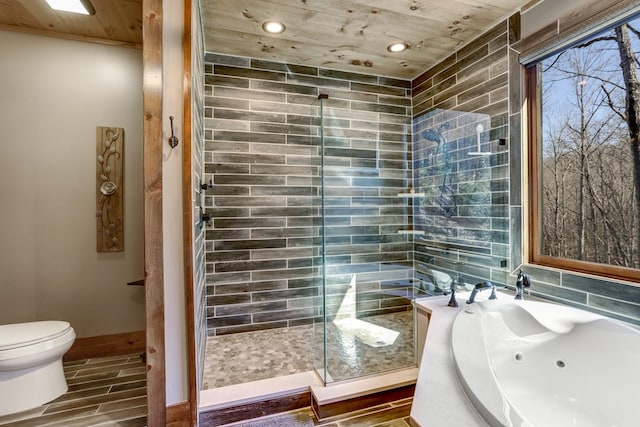 full bathroom featuring wood tiled floor, a whirlpool tub, a shower stall, wooden ceiling, and toilet