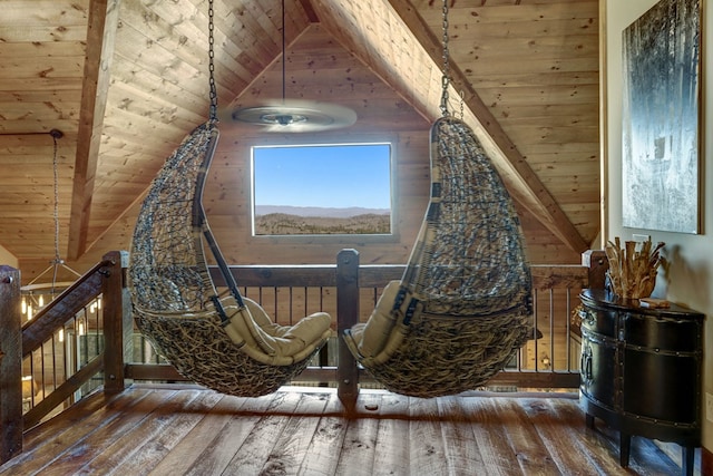 unfurnished room featuring an upstairs landing, wooden ceiling, vaulted ceiling with beams, and hardwood / wood-style flooring