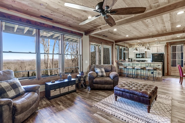 living area with beam ceiling, plenty of natural light, wood ceiling, and light wood-type flooring