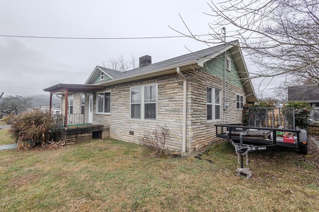 view of home's exterior with a yard