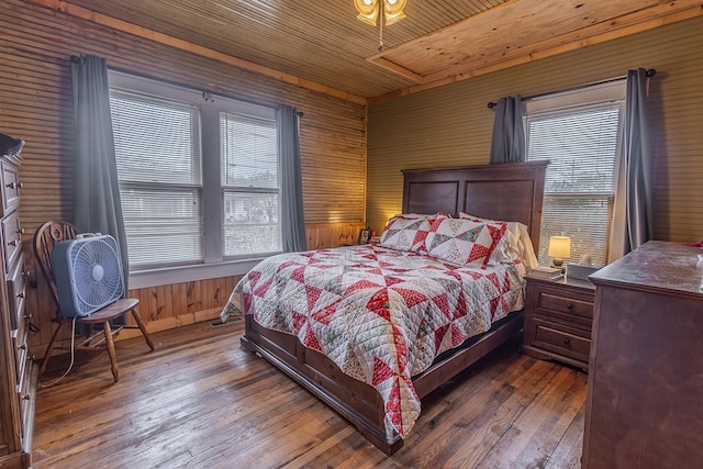 bedroom with hardwood / wood-style floors, wood ceiling, and wood walls