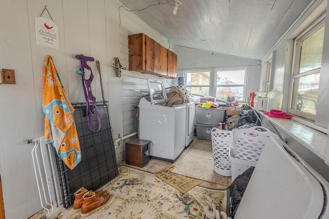 washroom featuring cabinets, wood ceiling, and washer and dryer