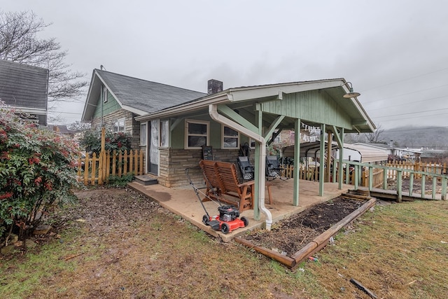 back of property featuring a patio