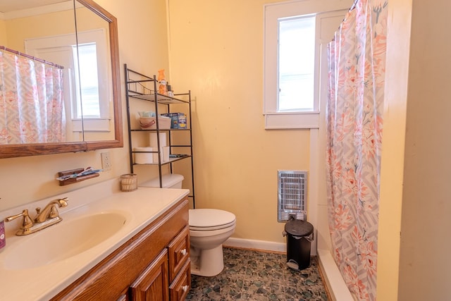 bathroom featuring vanity, toilet, a shower with shower curtain, and heating unit