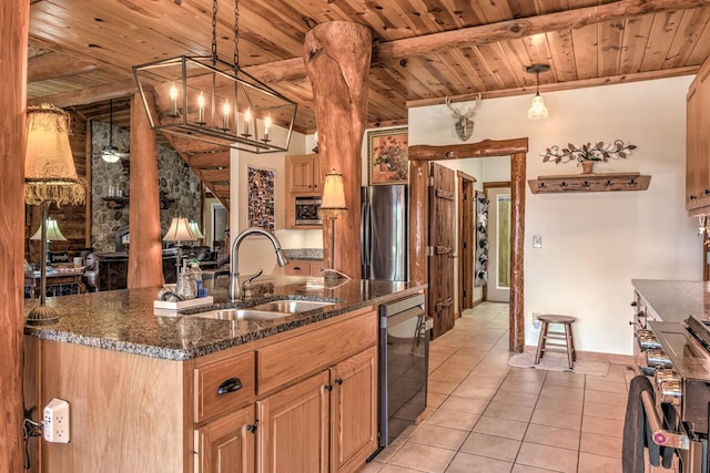 kitchen featuring an island with sink, appliances with stainless steel finishes, light tile patterned floors, decorative light fixtures, and wooden ceiling