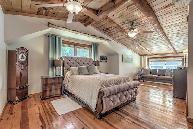 bedroom with lofted ceiling with beams, wood ceiling, ceiling fan, and light hardwood / wood-style flooring