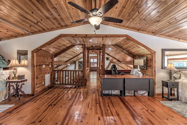 bonus room featuring wood-type flooring, vaulted ceiling, ceiling fan, and wooden ceiling