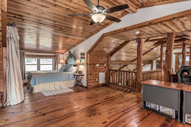 unfurnished bedroom with ceiling fan, wood ceiling, wood walls, hardwood / wood-style flooring, and lofted ceiling with beams