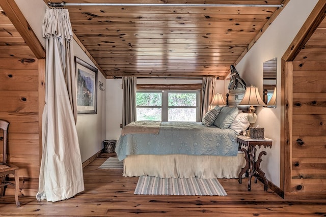 bedroom with wooden ceiling, vaulted ceiling, and hardwood / wood-style flooring