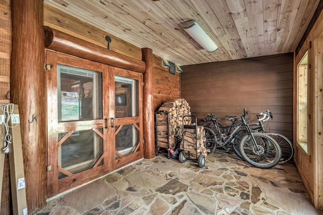 misc room featuring wooden walls and wooden ceiling