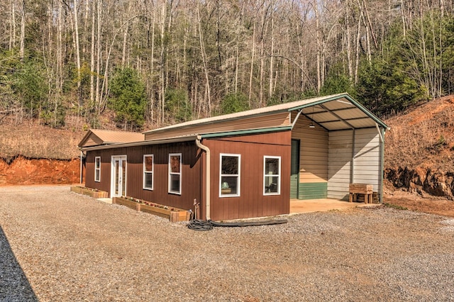 exterior space with a carport