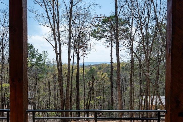 property view of mountains featuring a forest view