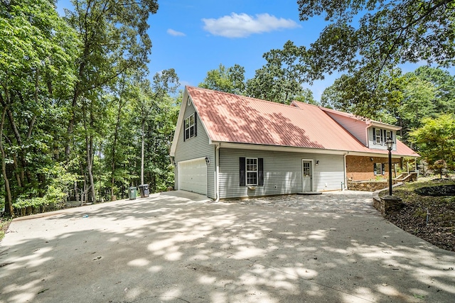 view of side of home featuring a garage