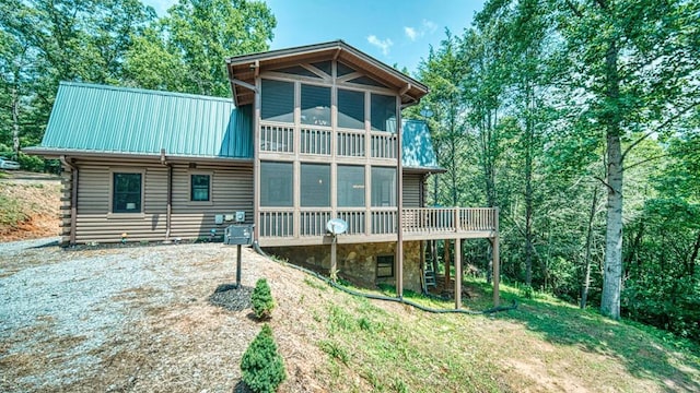 back of property featuring a sunroom