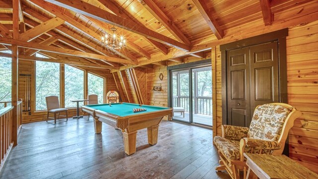 recreation room with wood-type flooring, wooden ceiling, wooden walls, and vaulted ceiling with beams