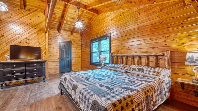 bedroom featuring wooden walls, hardwood / wood-style floors, wooden ceiling, and lofted ceiling with beams