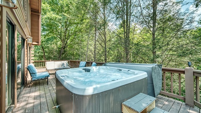 wooden terrace with a hot tub