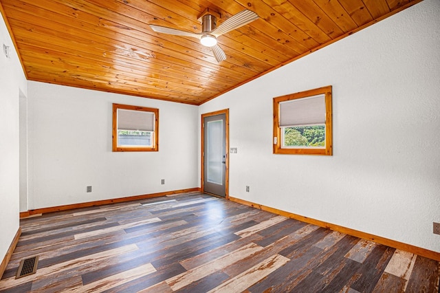 empty room with plenty of natural light, vaulted ceiling, wooden ceiling, and ceiling fan