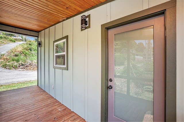 view of exterior entry featuring board and batten siding