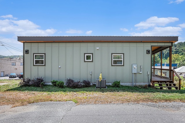 view of outdoor structure featuring central AC unit