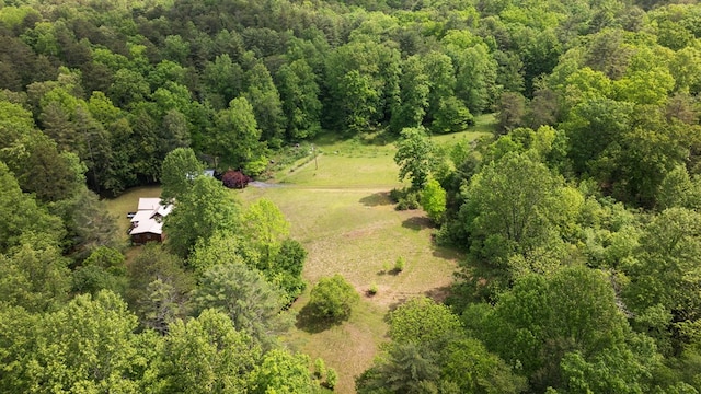 aerial view of property's location featuring a forest and rural landscape