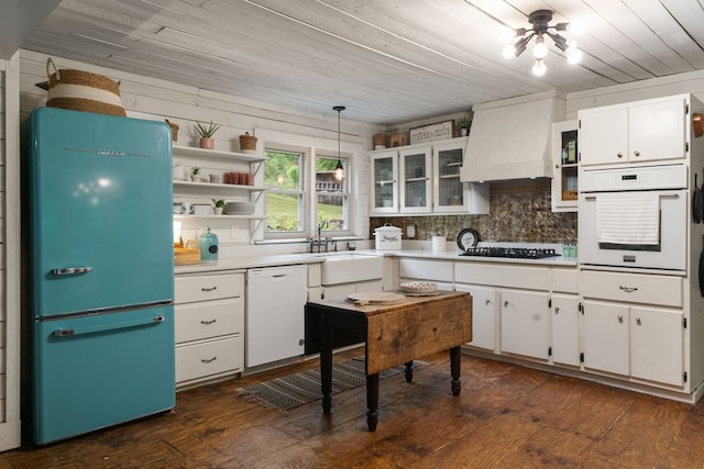 kitchen featuring white appliances, white cabinetry, wooden ceiling, light countertops, and dark wood-style flooring