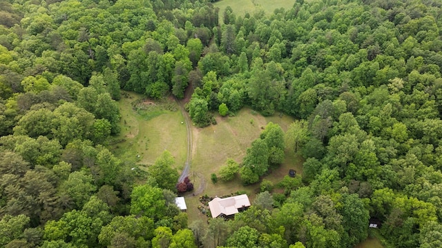 aerial overview of property's location featuring a heavily wooded area