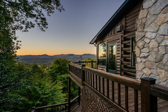 deck at dusk with a mountain view