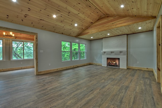 unfurnished living room with recessed lighting, lofted ceiling, wood finished floors, baseboards, and a fireplace