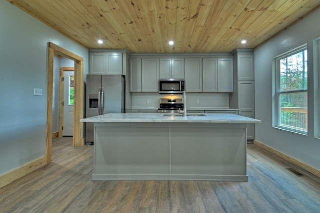 kitchen featuring wood ceiling, stainless steel appliances, baseboards, and recessed lighting