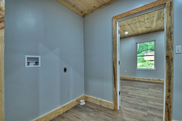 clothes washing area with wood finished floors, hookup for an electric dryer, wood ceiling, baseboards, and washer hookup