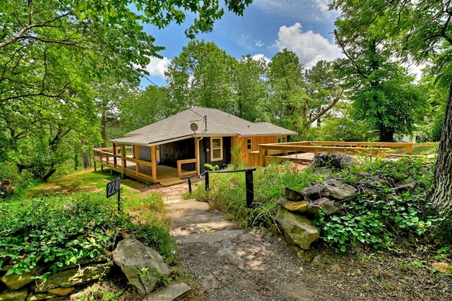 back of house with a wooden deck