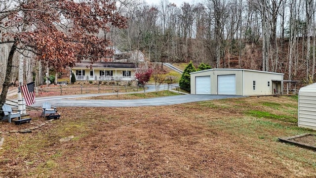 view of yard with an outbuilding and a garage