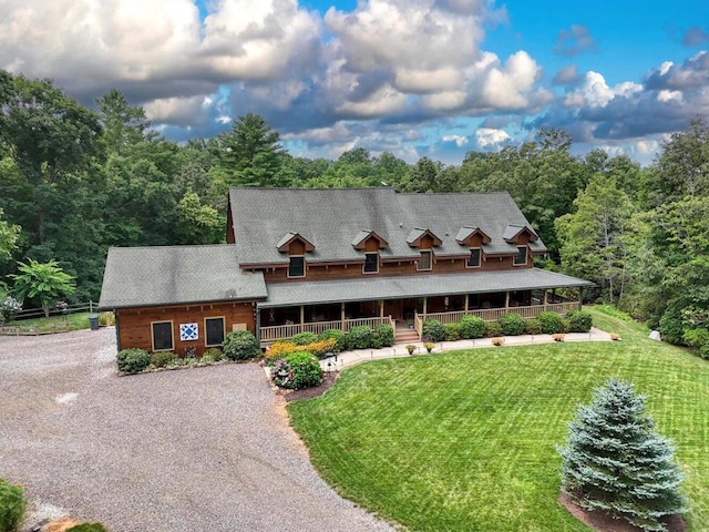 view of front of property featuring a front lawn and covered porch