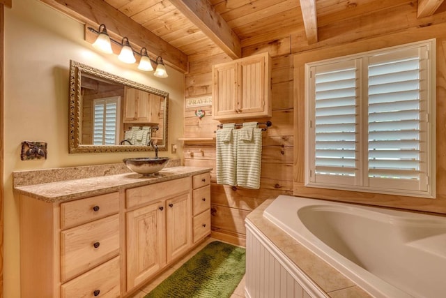 bathroom featuring wooden ceiling, vanity, wooden walls, a bathing tub, and beam ceiling