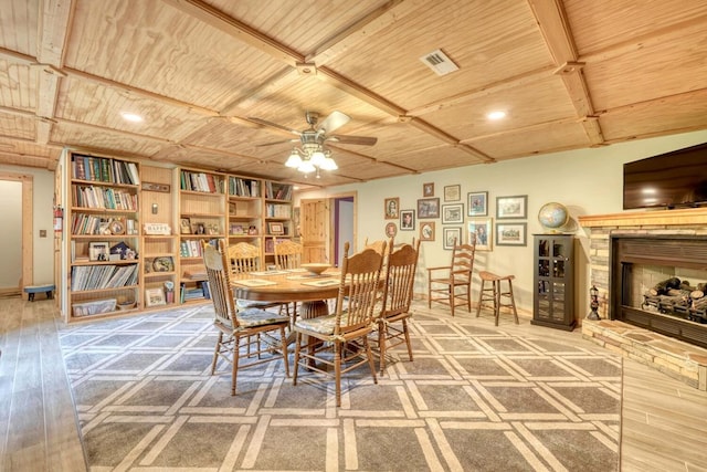 dining space featuring hardwood / wood-style floors, wood ceiling, and ceiling fan