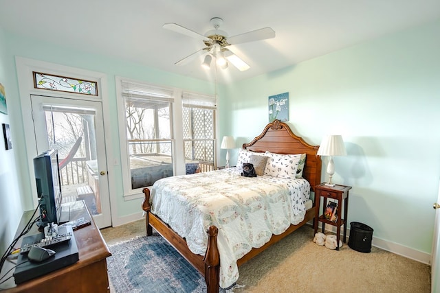 bedroom featuring light carpet, access to exterior, and ceiling fan