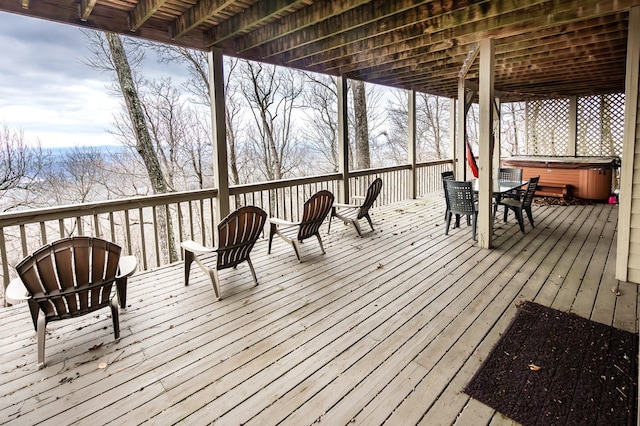 wooden terrace with a hot tub