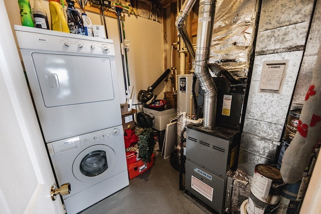 laundry area with stacked washer / drying machine