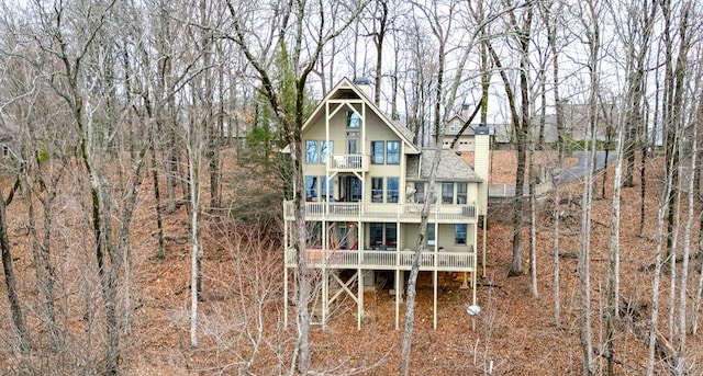 back of property featuring a balcony