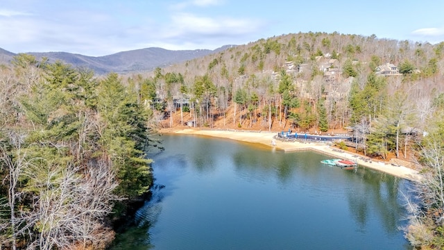 aerial view featuring a water and mountain view