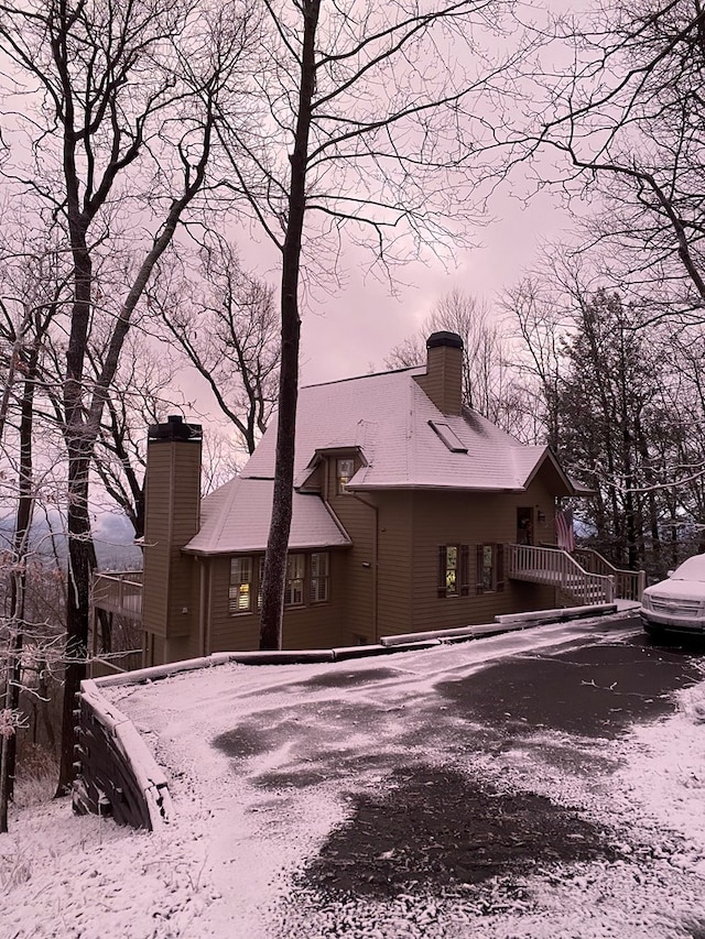 view of back house at dusk